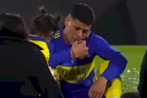 Man Utd flop Marcos Rojo slammed for smoking fag on pitch with family after Boca win