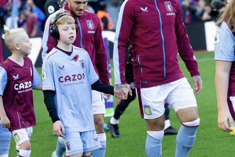 Aston Villa star Danny Ings shows his class by wearing noise-cancelling headphones like mascot for..