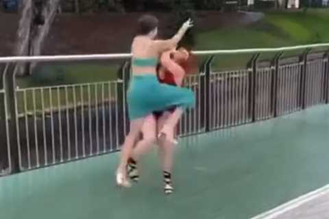 Vicious six-woman brawl erupts at the races with punches & dresses flying everywhere as one..