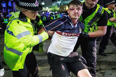 Manchester City fans smash up cop van and clash with riot police after side wins Champions League..