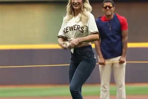 Paige Spiranac stuns baseball fans in unbuttoned shirt as she throws the first pitch at the..