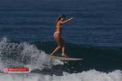 Surfers (longboard) at Oceanside, CA for Supergirl Pro