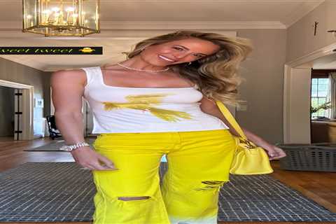 Jena Sims stuns in bold outfit as she wears low-cut top and eye-catching trousers to cheer Brooks..