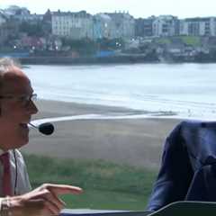 ‘He is spooked’ – Moment The Open commentator hides under his jacket as BAT invades broadcasting..
